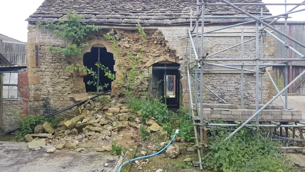 The partially collapsed north wall prior to the commencement of works